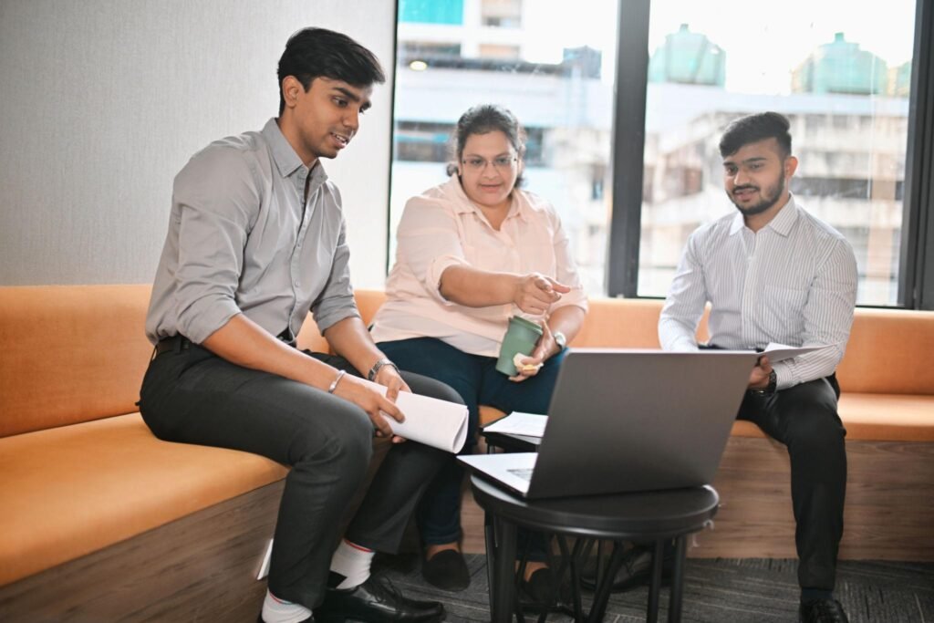 Young Indian professionals developing leadership skills with experienced business leaders